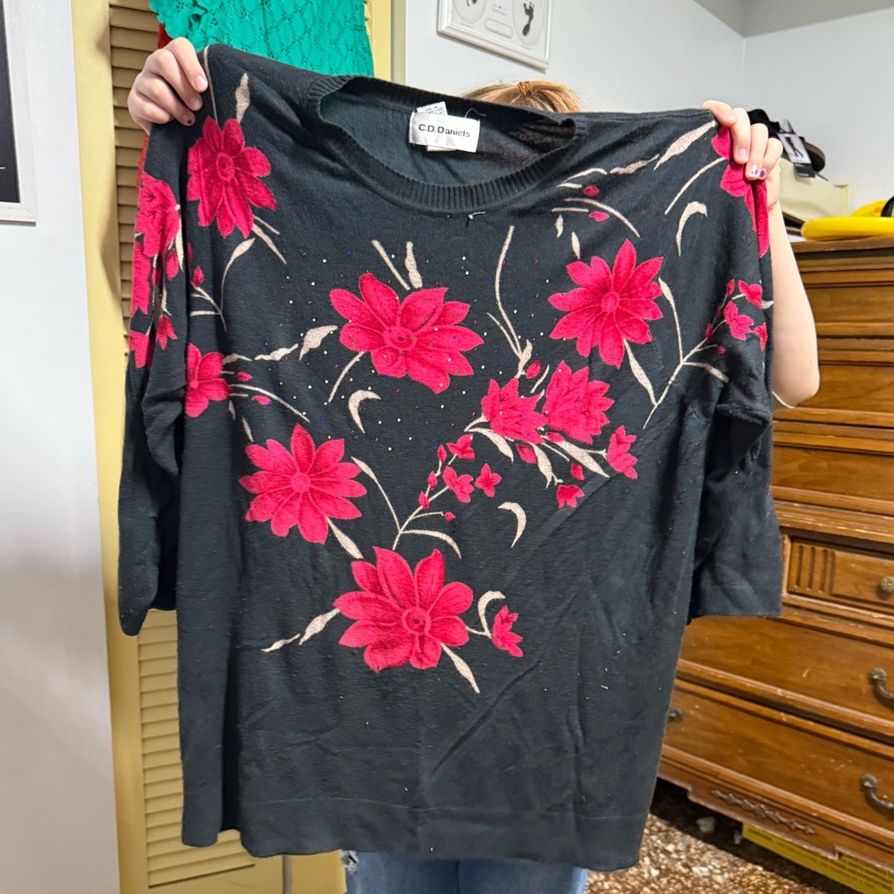 Lightweight sweater with flowers and gems.
